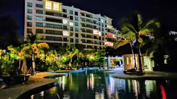 The resort pools lit up at night