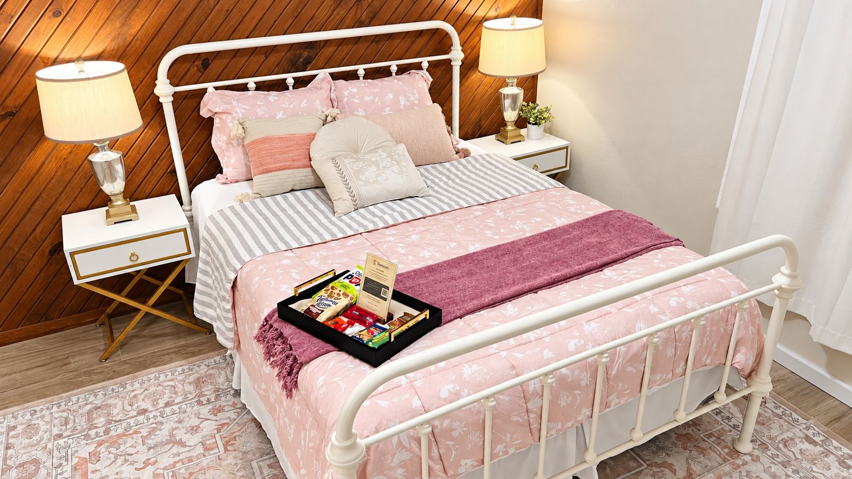 A neatly arranged bedroom with a bed, bedside tables, and a bedside lamp.
