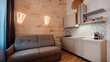 A modern kitchen with a built-in stove, a sink, and a countertop.