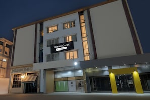 A multi-story building with a prominent sign reading 'TOWNHOUSE & Company Services'. - Townhouse Narayanaguda Metro Station (Hyderabad)