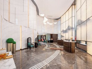 A modern lobby with a marble floor, reception desk, seating area, and large windows. - Metropolo Jinjiang Guilin Rail St Mixc (guilin)