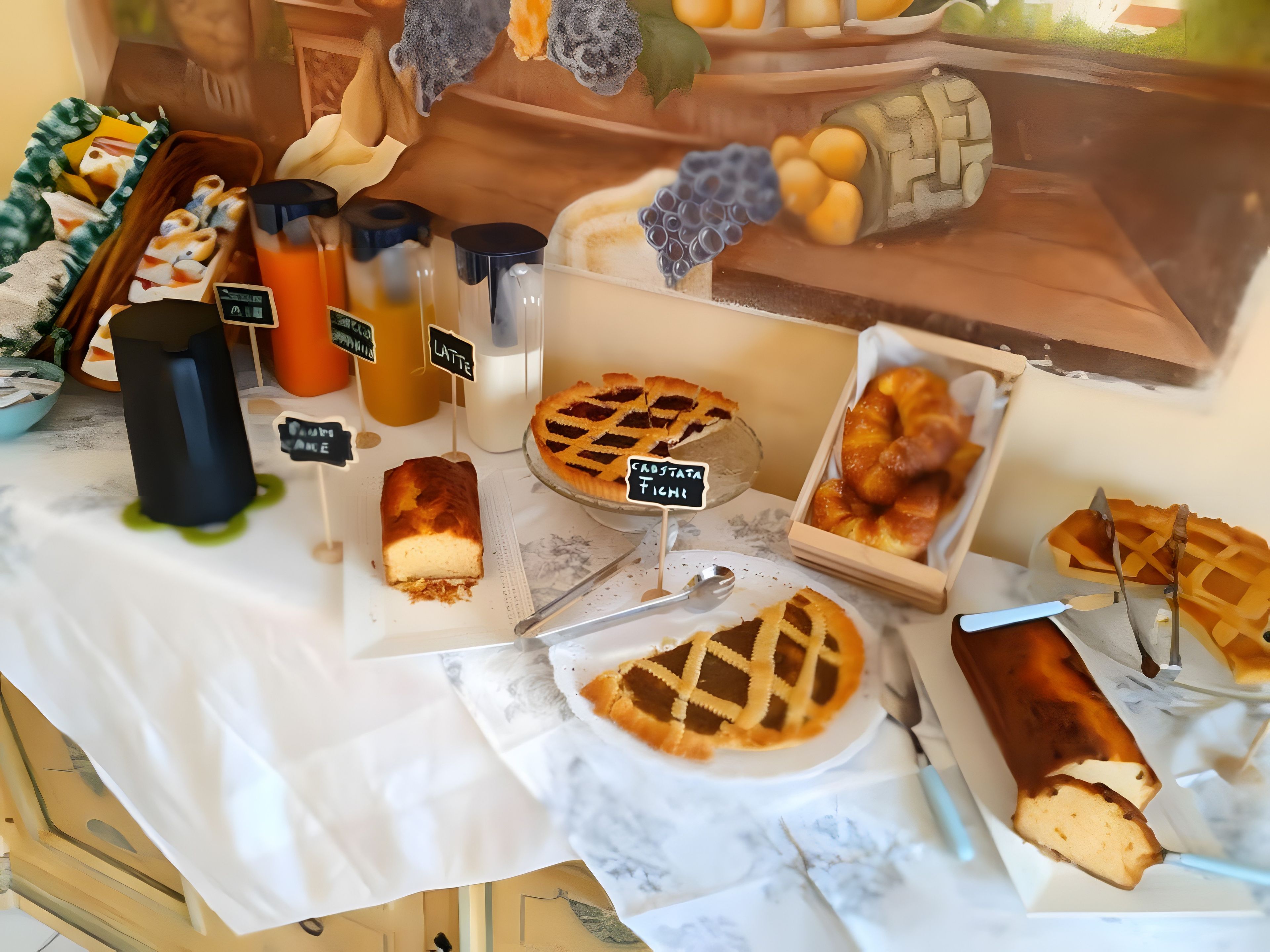 A dessert display with various baked goods and beverages.