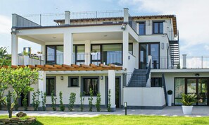 A modern two-story house with a covered patio, a staircase, and a small garden. - Apartment in Mazzarino with 1 bedrooms sleeps 2 (Mazzarino)