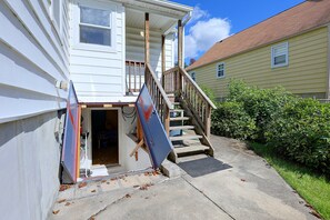 A residential building with a wooden staircase leading to a porch. - Studio Guest Suite Outside Baltimore (Parkville)