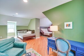 A bedroom with a bed, a desk, a chair, and a window. - Deck & Yard! Tri-City Family Home Near UNC & Duke (Chapel Hill)