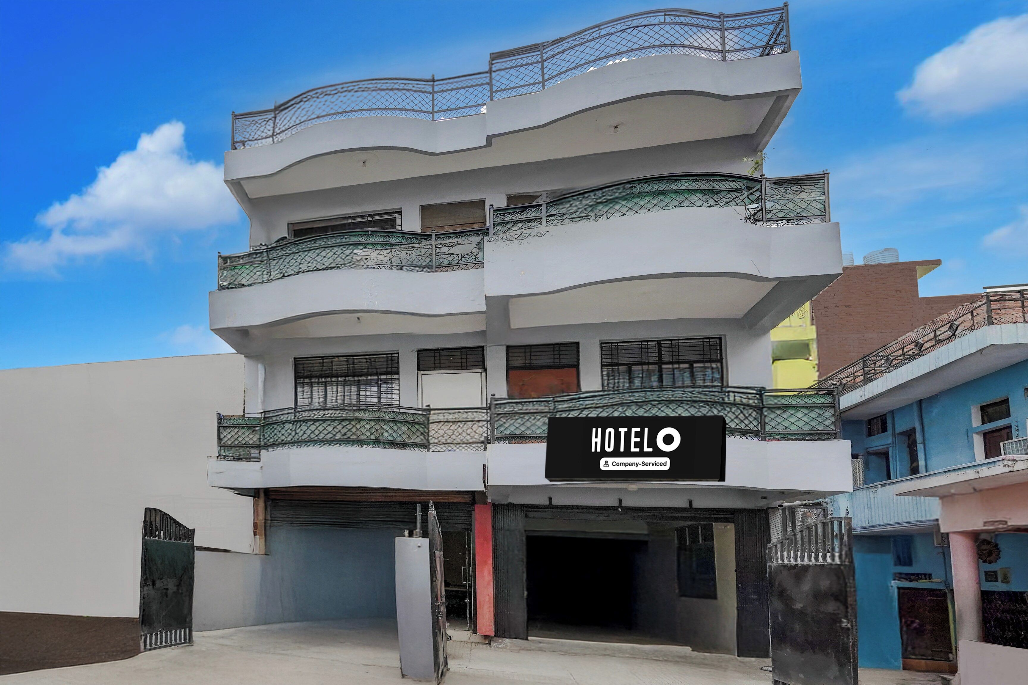A multi-story building with a sign indicating it is a hotel.