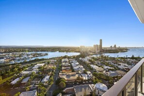 A high-rise building with a view of a marina and a cityscape. - Luxury Broadwater Retreat at Lagoon Main Beach (Main Beach)