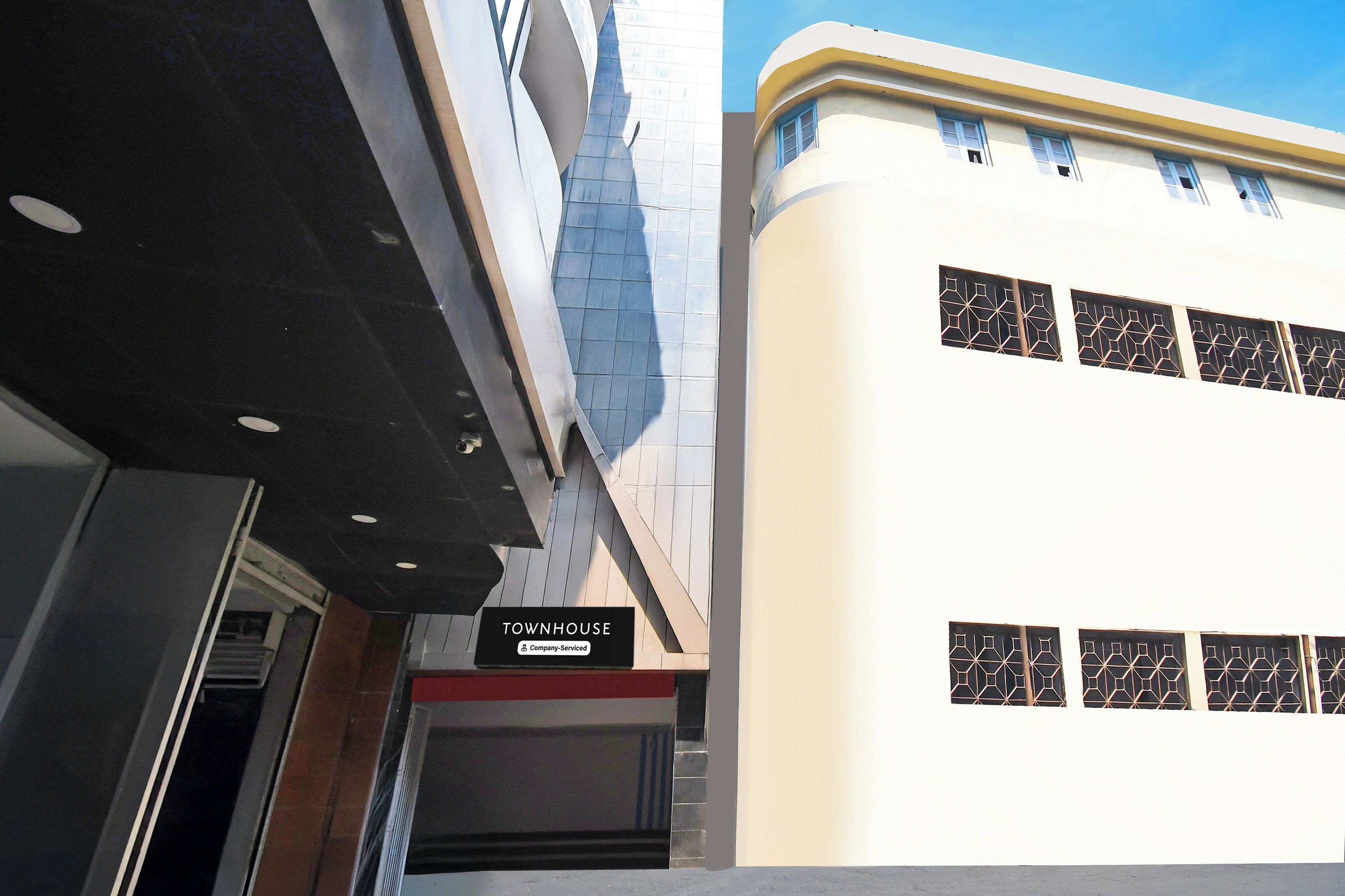 A building with a sign reading 'TOWNHOUSE' and a company-serviced logo.