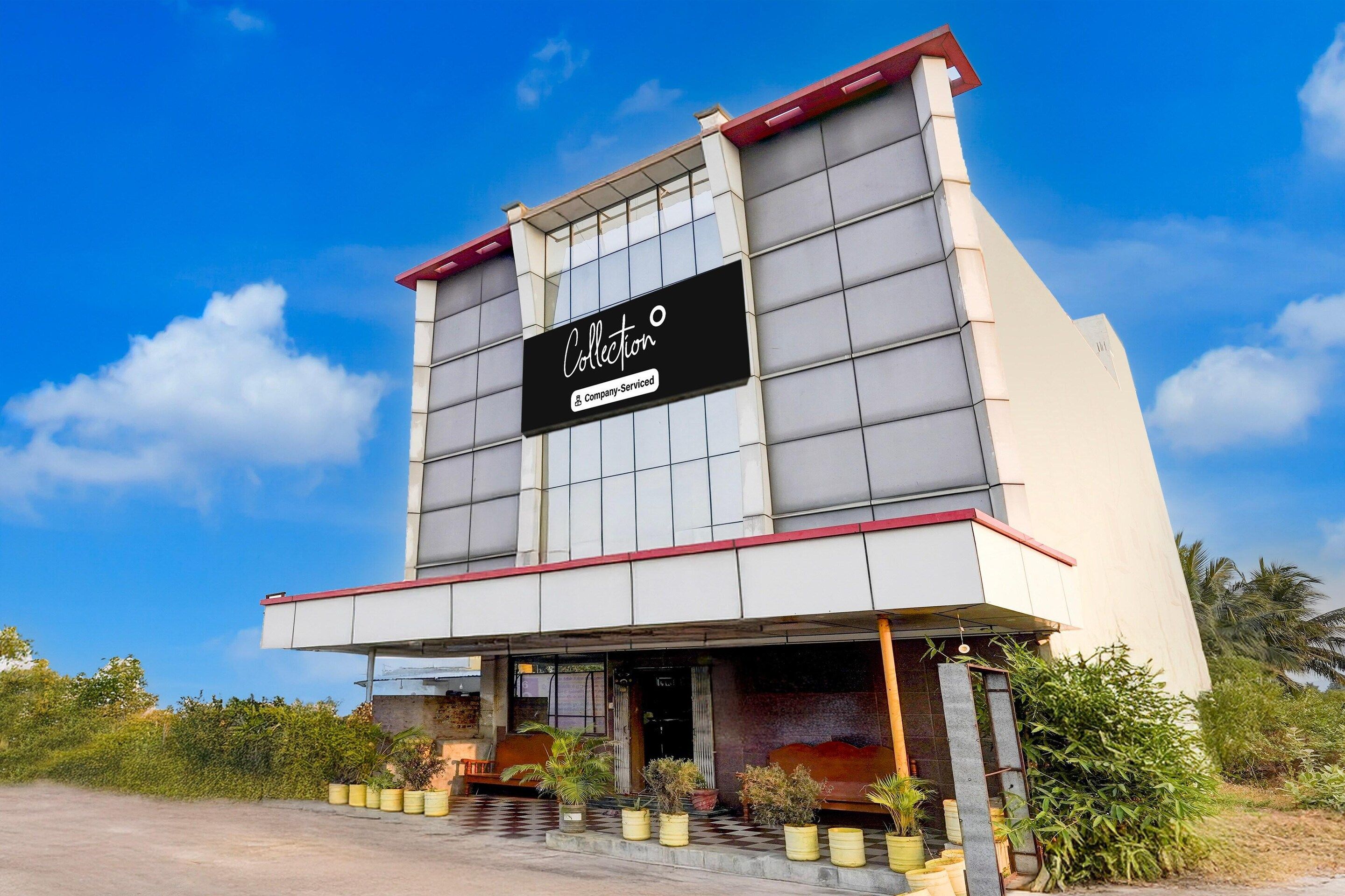 A modern building with a sign that reads "Collection."