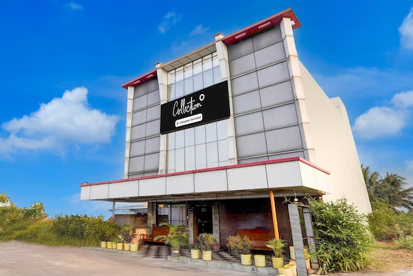 A modern building with a sign that reads "Collection."