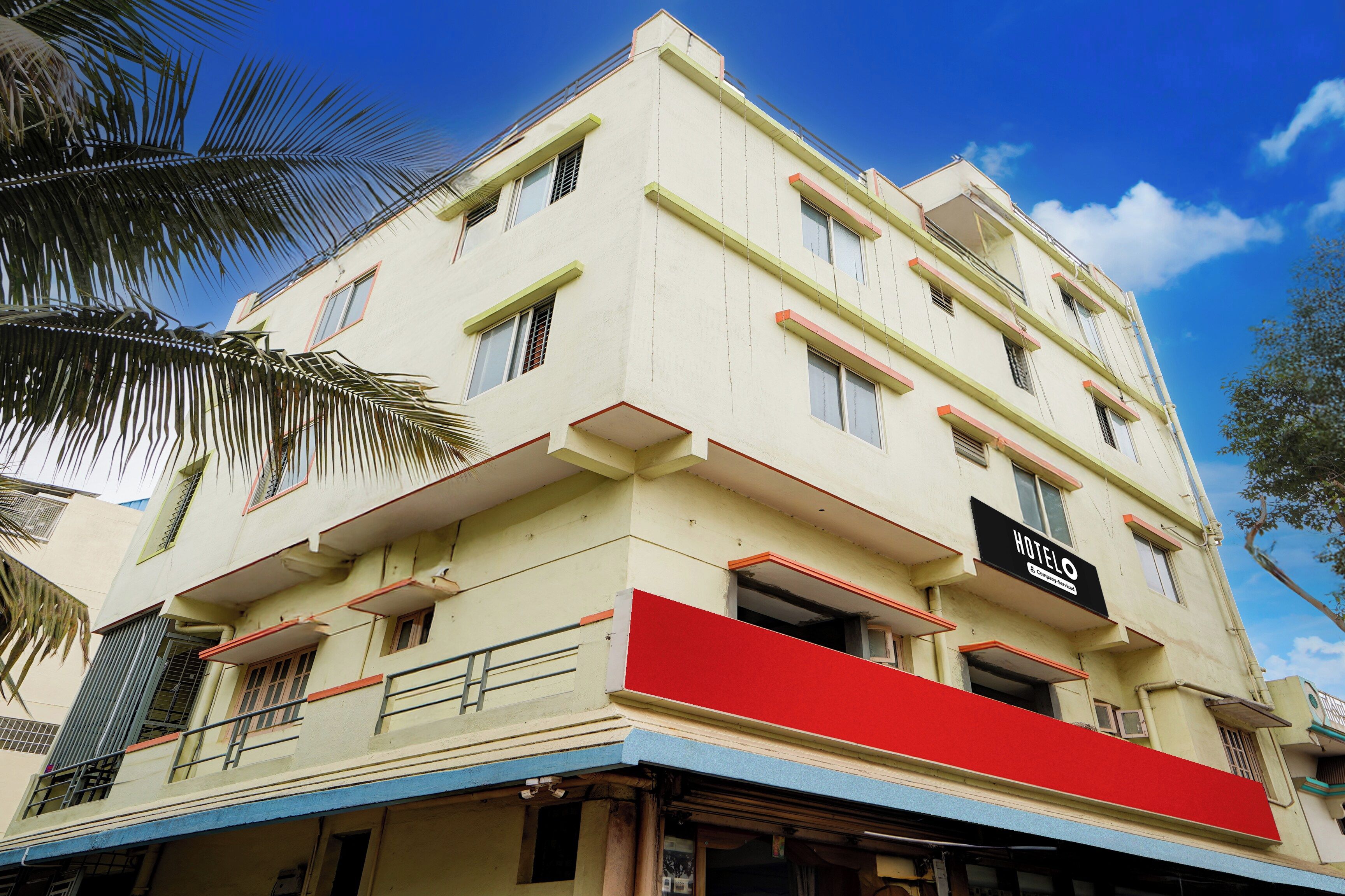 A multi-story building with a sign indicating it is a hotel.