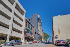 A street view with a hotel named 'Park Hotel' and a building with a 'Charger' sign. - 7th-floor Condo: Walk to Cafes, Dining & More (Chattanooga)