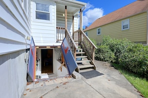 A residential building with a wooden staircase leading to a porch. - Studio Guest Suite Outside Baltimore (Parkville)