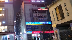 A hotel named 'Hotel Pratiksha' with a sign indicating 'Hotel Stay-In Rooms' and 'Hotel Stay-In Rooms' in another language. - Hotel Stay Inn (Ahmedabad)