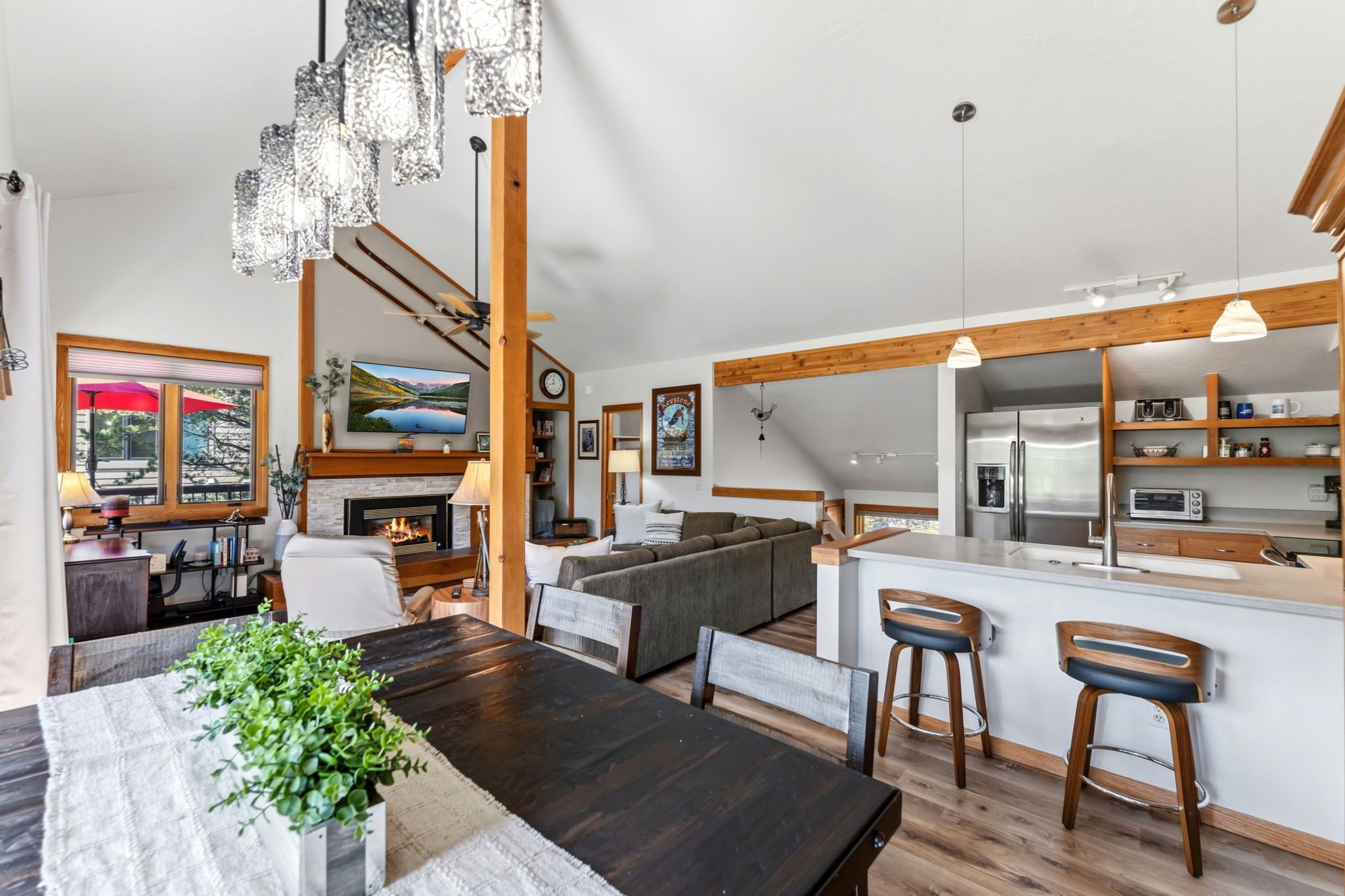 A modern kitchen with a built-in oven, a refrigerator, and a sink.