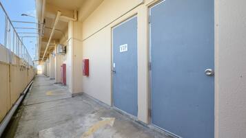 A corridor with doors marked 'VIP' and a clear path indicated by arrows on the floor.