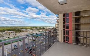 A balcony with a view of a parking lot and buildings. - Phoenix Ii 2091 3 Bedroom Condo (Orange Beach)