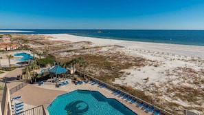 A resort with a swimming pool, beach access, and a view of the ocean. - Phoenix East 505 1 Bedroom Condo (Orange Beach)