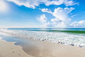 A beach with clear skies and waves. - Phoenix East 1405 1 Bedroom Condo (Orange Beach)