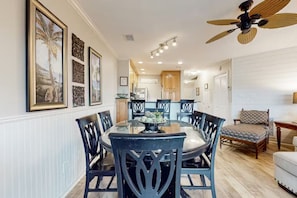 A dining area with a round table, chairs, and a ceiling fan. - Beach House On The Lake 232 3 Bedroom Condo (Miramar Beach)