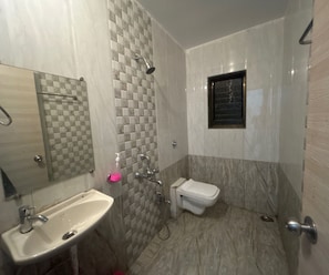 A bathroom with a sink, toilet, and shower. - Deluxe With Balcony Oraa Stay (Mahabaleshwar)