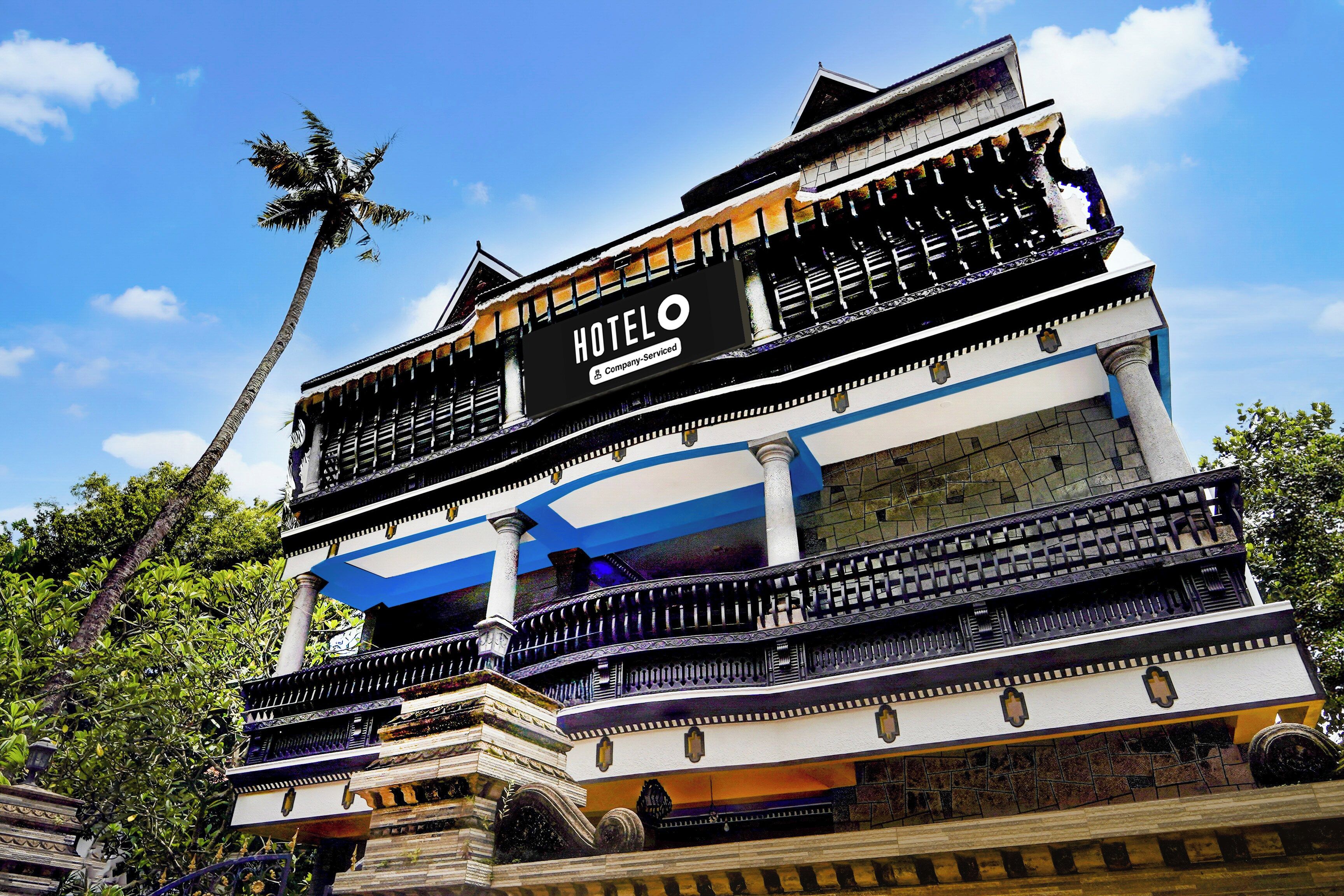 A multi-story hotel with a prominent sign reading 'HOTEL & Company-Service'.