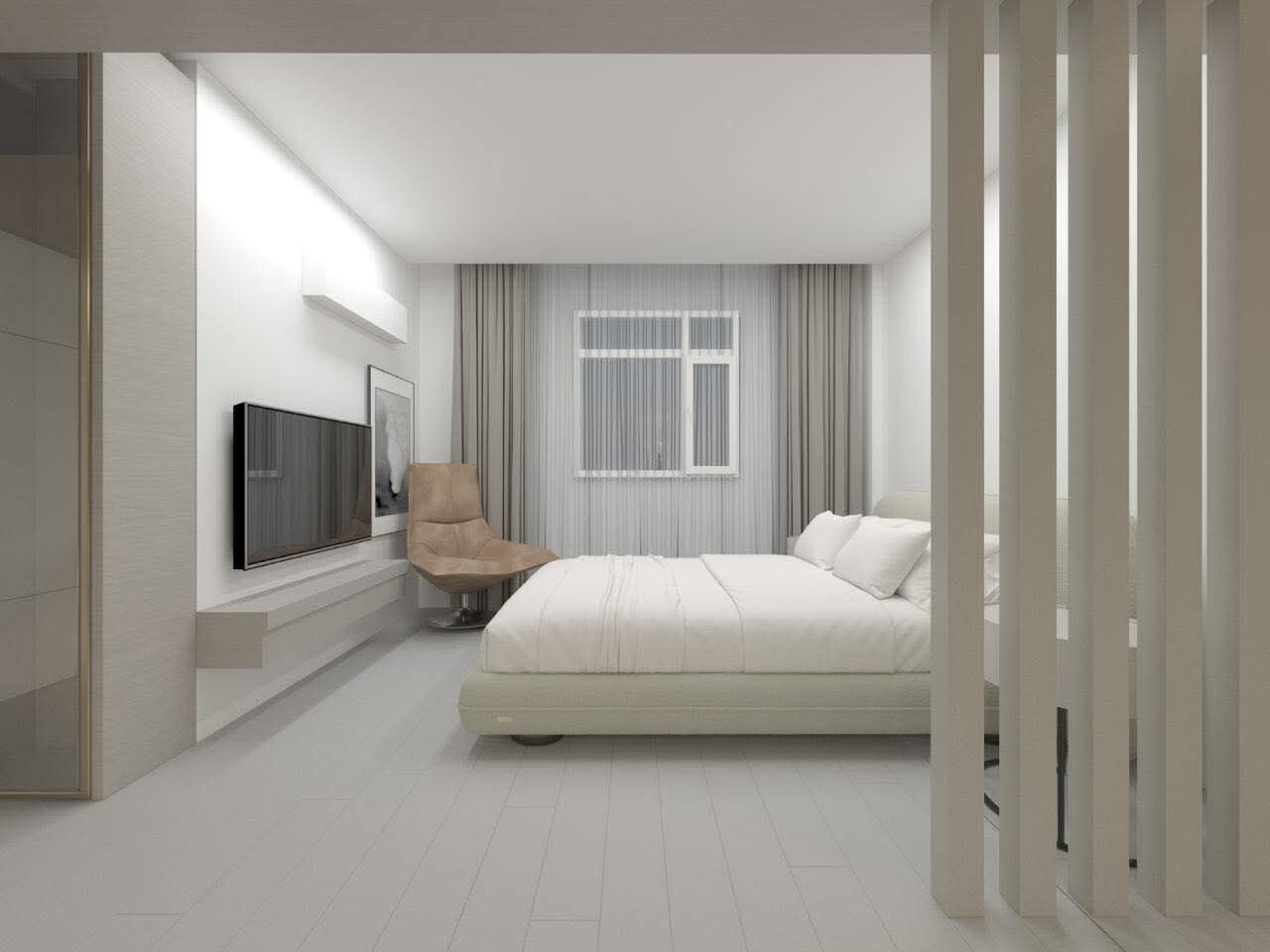 A modern bedroom with a bed, a chair, a TV, and a window with curtains.