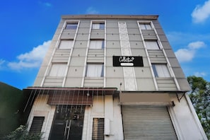 A multi-story building with a sign that reads 'Collection Company-Serviced'. - Collection O by OYO Townhall Heritage (Amritsar)