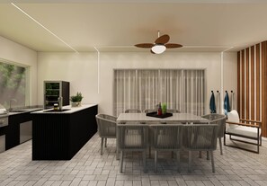Cozinha moderna com ilha central, área de refeições com cadeiras e ventilador de teto.