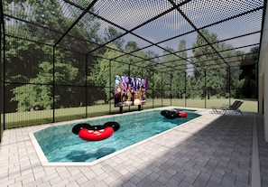Una piscina interior con recinto de malla, una pantalla de televisión y flotadores inflables.