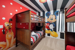 A room with a bunk bed, a Mickey Mouse mural, and a Snoopy mural. - Disney Escape, Family Retreat, Private Pool (Davenport)