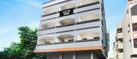 A multi-story hotel building with a sign indicating it is a hotel.