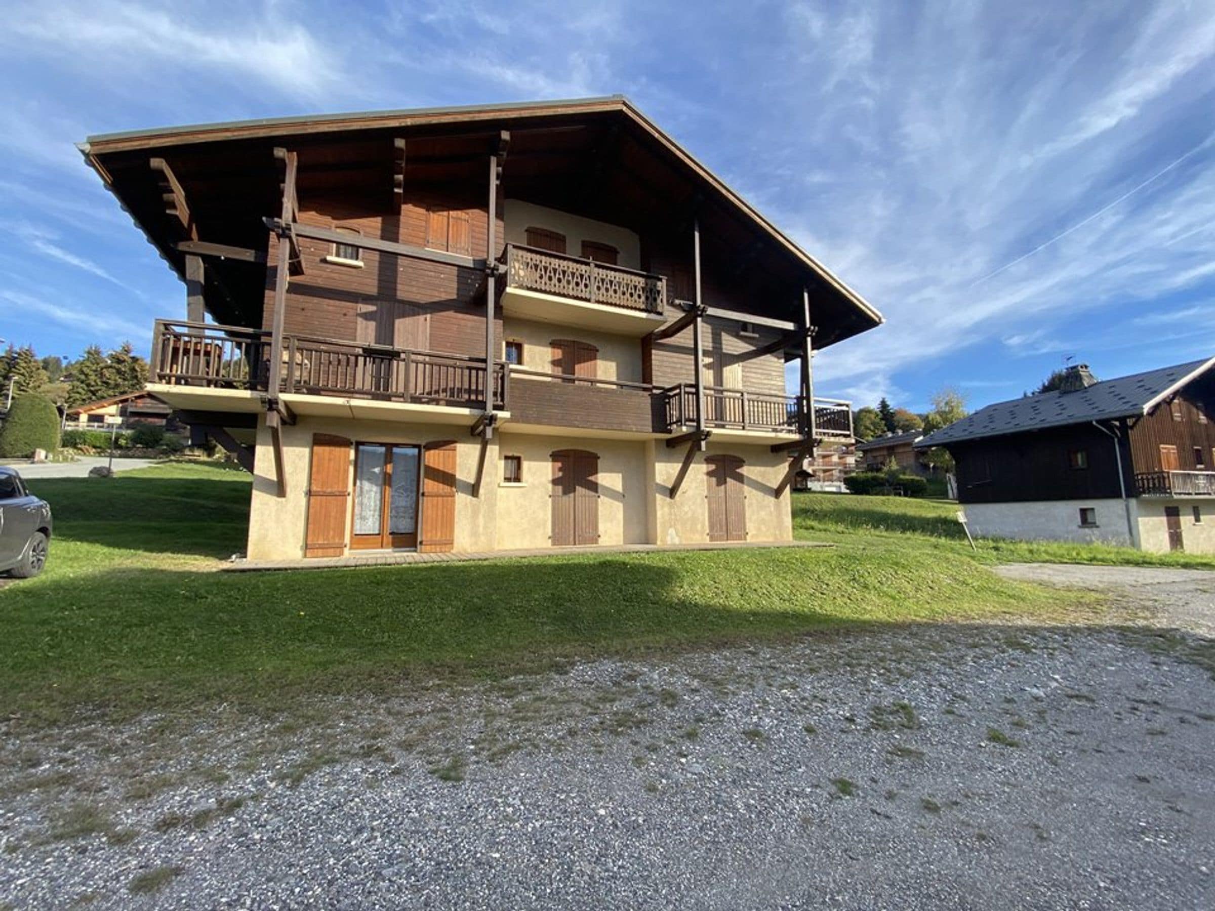 A two-story building with a balcony on the upper floor.