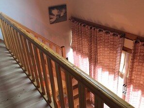 A wooden staircase with a handrail leading to a landing. - Duplex, pets welcome - 8 guests (Valloire)