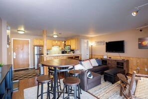 A compact living space with a kitchen, dining area, and seating area. - SE033 | Newly Remodeled | Hot Tub | Ski In/Out (Steamboat Springs)