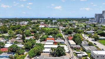 A residential area with houses, roads, and greenery.