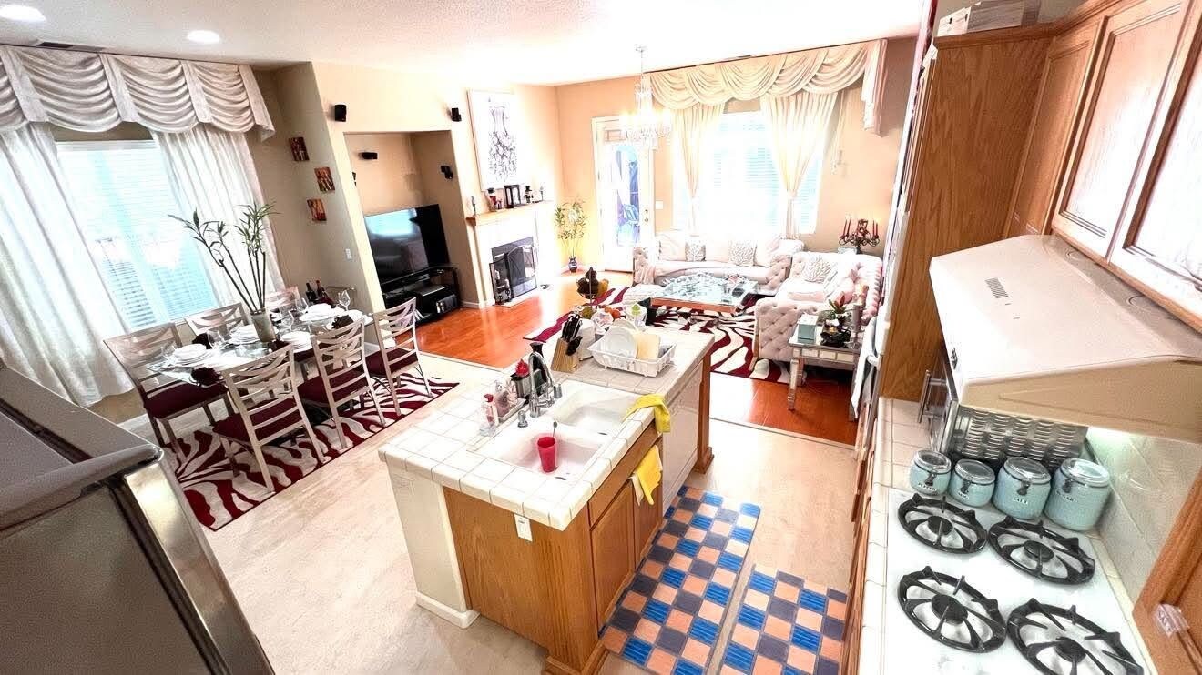 A compact living space with a dining area, kitchen, and seating area.