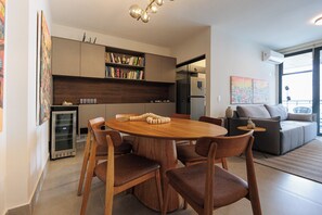 A modern living space with a dining area, kitchen, and seating area. - New Listing (Rio de Janeiro)