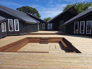 A building with multiple rooms, each with large windows and a flat roof. - New Listing (Puerto montt)