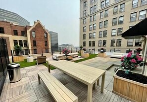 Rooftop: Rooftop area at our sister property, just a 1-minute walk away—perfect for relaxing and enjoying some fresh air. - Charming 1BR King Bed - Just 20 Minutes from NYC! (Newark)