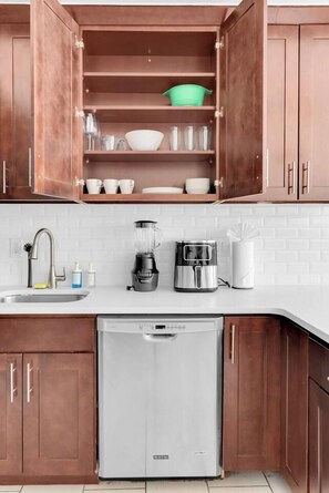 Extra Plates, serving bowls, and cooking plater along with storage containers - 2BR 20 min to NYC! Stylish Fun Cozy & Spotless (Newark)