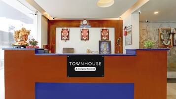 A reception desk with a sign indicating 'Townhouse' and 'Company-Served'.