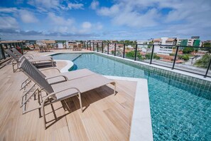 A rooftop swimming pool with lounge chairs and a view of the cityscape. - New Listing (Ipojuca)
