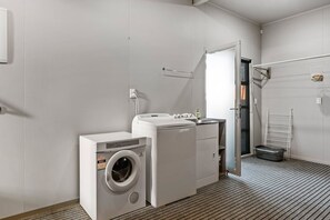 A laundry room with a washing machine, dryer, and a drying rack. - View from the Top - lake & mountain views! (Taupo)