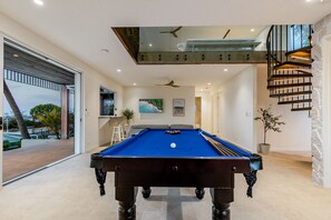 A pool table in a modern interior with a view to the outside. - The Kopper House: Luxury in 1770 (1770)