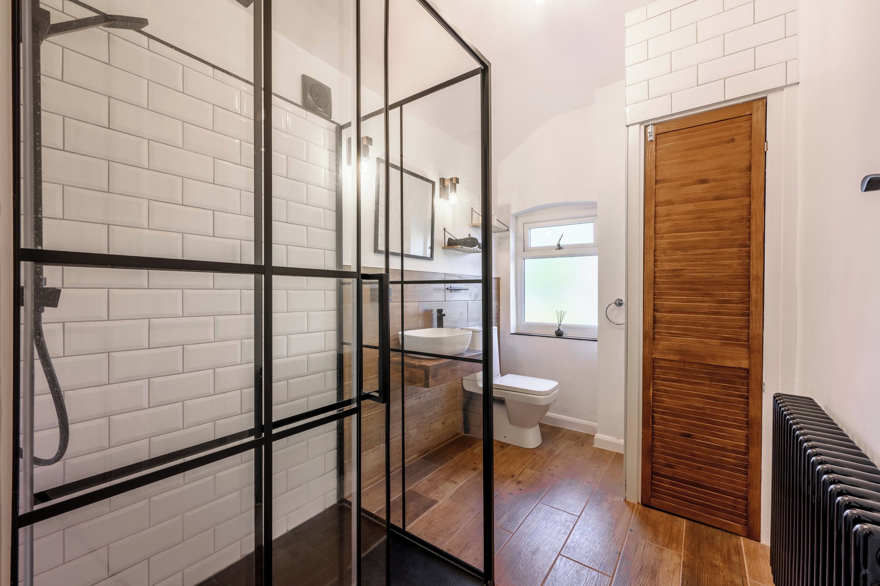 Newly renovated upstairs shower room with a large walk-in rainfall shower. With a second bathroom downstairs, there are no morning queues, even with six guests in the house.