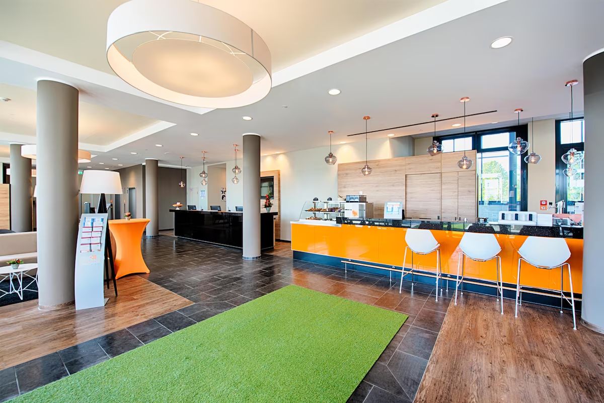 Start your day in a vibrant lobby with casual gathering spaces.