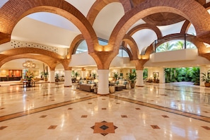 A spacious lobby with high brick arches, polished marble floors, and multiple seating areas. - Luxury 1 Bedroom Getaway at Club Velas Vallarta, All Inclusive Mexico Paradise (Puerto Vallarta)