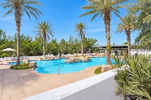 A swimming pool with palm trees and lounge chairs. - Selah on 30A | Golf Cart, Pool & Hot Tub, Mins to the Beach (Santa Rosa Beach)