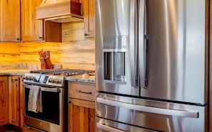 Modern appliances and ample counter space make the kitchen comfortable and convenient for your stay. - The Walkin Wyla- newly built barndominum (Cody)